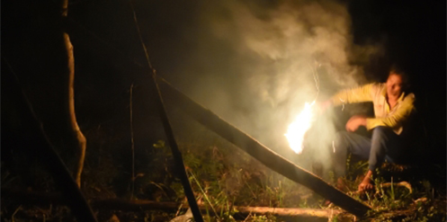 At the same time, another man began igniting one end of the rolled bark sticks, swooshing and blowing on the flames to ensure a steady stream of embers and smoke would be produced.