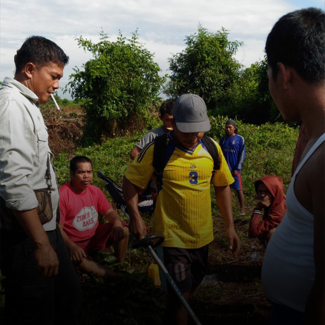 Villagers trying the lawn mower.