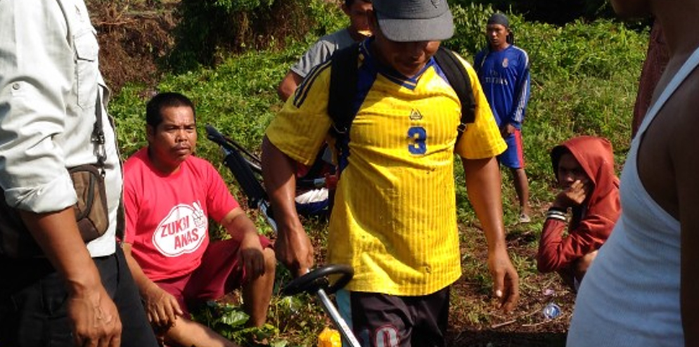 Villagers trying the lawn mower.